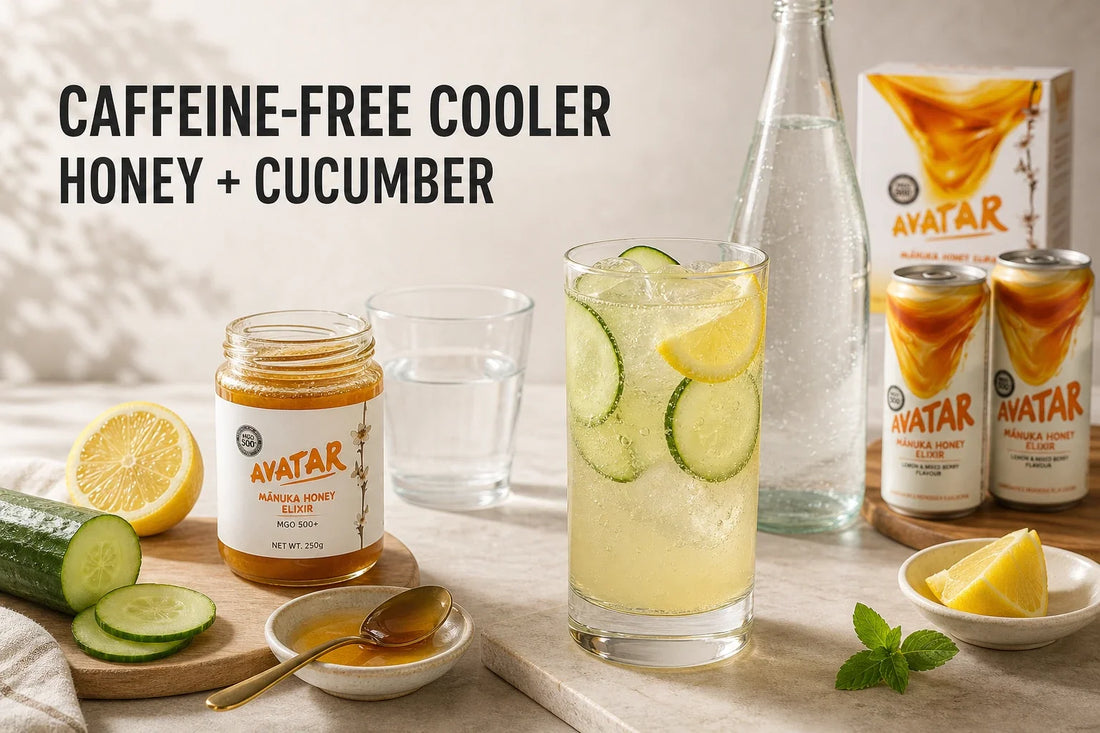 A honey, cucumber, and lemon sparkling cooler beside jarred Mānuka honey, fresh ingredients, and unopened Avatar Elixir cans set aside as bundle context.