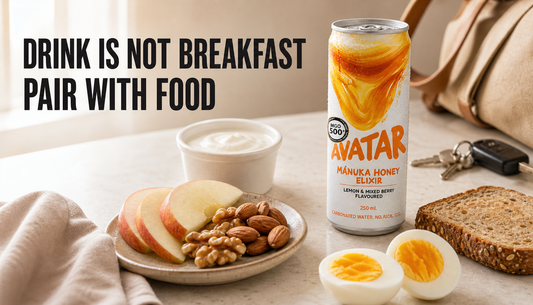 Avatar Elixir can beside yogurt, fruit, nuts, egg, and toast on a morning counter with the headline Drink Is Not Breakfast, Pair With Food.