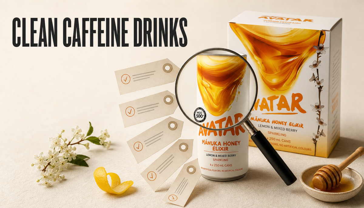 Avatar Manuka Honey Drink pack and can on a warm studio surface with a magnifying glass and blank label-check tabs, headed Clean Caffeine Drinks.