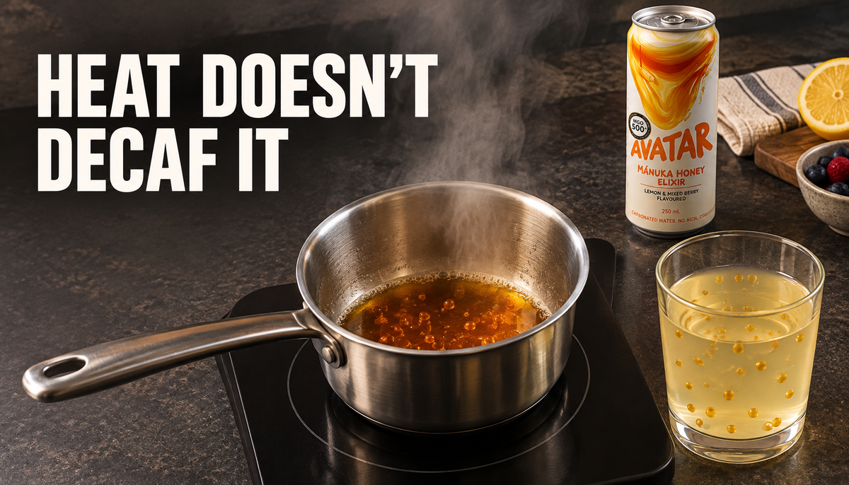 Editorial kitchen-lab hero image showing steam rising from a reduced amber drink while caffeine markers remain, with a diluted glass and an Avatar Elixir can nearby, under the hea...