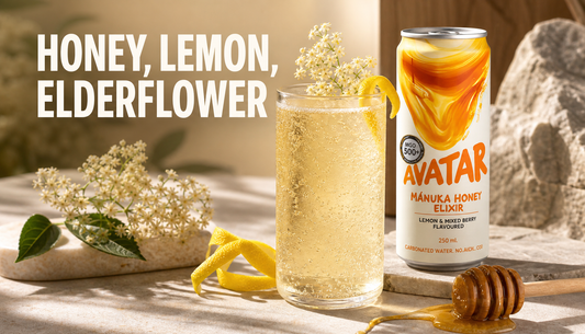 Avatar Elixir can beside a sparkling honey, lemon, and elderflower drink with honey, lemon peel, elderflower, and bubbles arranged to show balanced flavor layers.