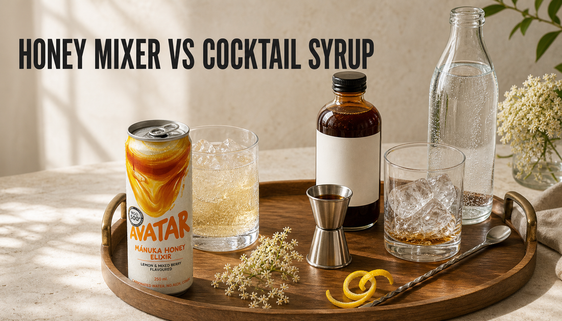 Editorial home bar comparison of an opened Avatar Elixir honey mixer can beside a glass of ice and a generic cocktail syrup setup with jigger, spoon, and sparkling water, with hea...