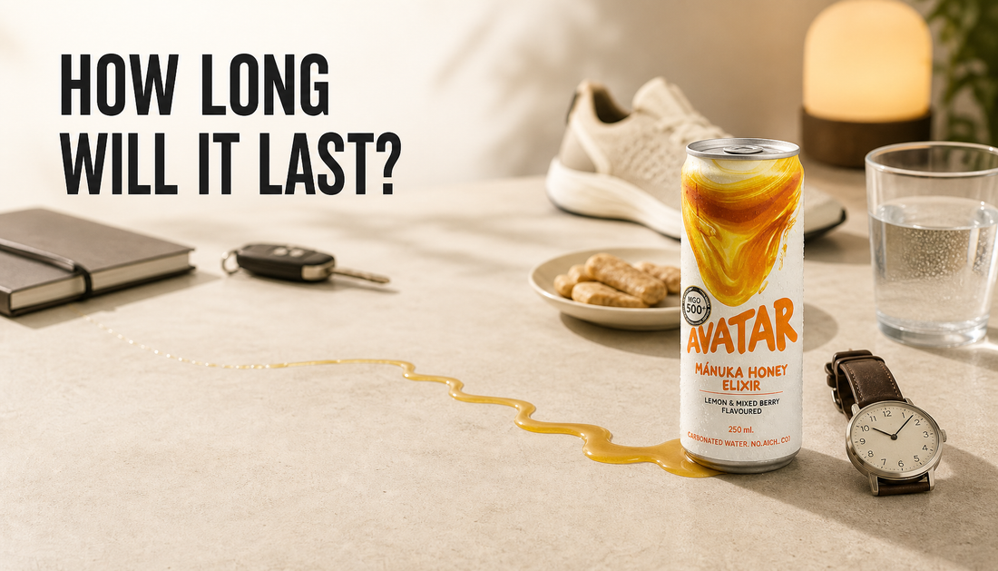 Avatar Elixir can beside a watch, water, snack, and fading amber trail illustrating how long a natural energy drink may feel noticeable.