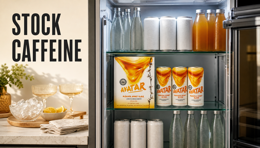 Open home beverage fridge organized for guests by caffeine preference, with The Beekeeper’s Choice 12Pk among generic still and sparkling drink options.