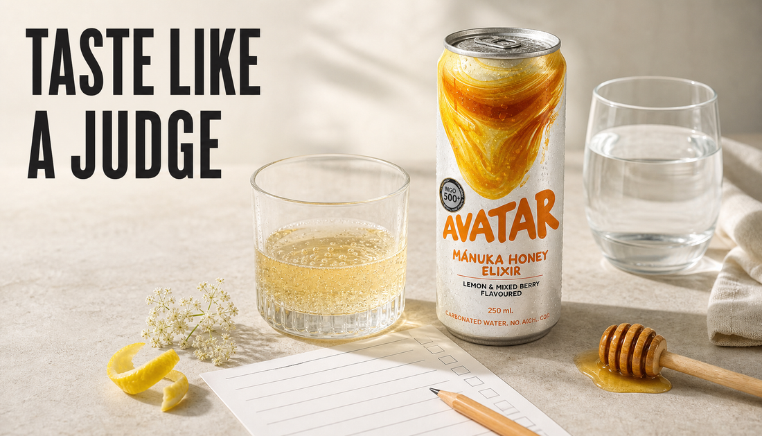 Avatar Elixir can beside a small sparkling pour in a clean glass, water, pencil, and blank tasting scorecard with the headline Taste Like A Judge.