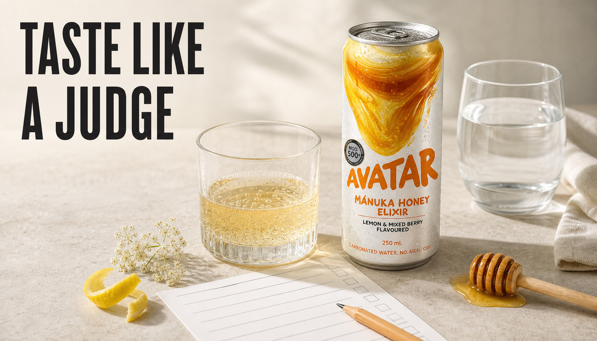 Avatar Elixir can beside a small sparkling pour in a clean glass, water, pencil, and blank tasting scorecard with the headline Taste Like A Judge.