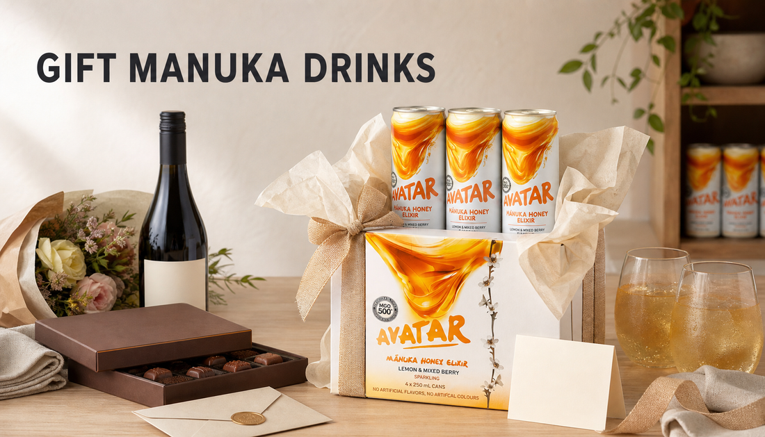 The Beekeeper’s Choice 12Pk styled as a thoughtful Manuka honey drink gift with ribbon, serving glasses, and familiar gift alternatives nearby.
