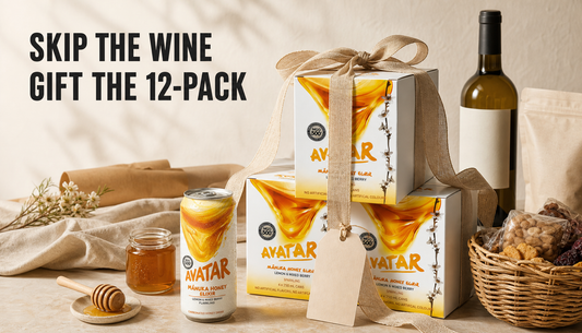 The Beekeeper’s Choice 12Pk styled as a ribbon-wrapped gift on a warm table, replacing ordinary wine, coffee, and snack hamper options.