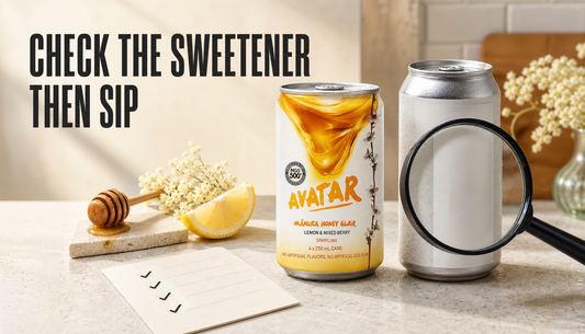 Avatar Elixir can and an unlabeled energy drink can on a kitchen counter with a magnifying glass aimed at the ingredient panel and headline text reading Check the Sweetener, Then...