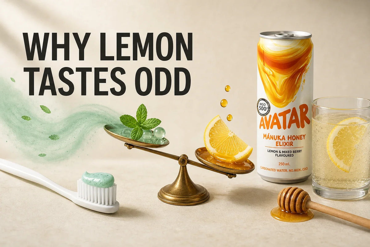 Editorial tabletop hero showing an Avatar Elixir can, lemon drink, toothbrush, and mint toothpaste as a visual metaphor for why lemon can taste odd after brushing.