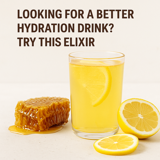 Glass of sparkling yellow hydration drink with lemon slices and a honeycomb on a light background, promoting a clean, naturally energising elixir.